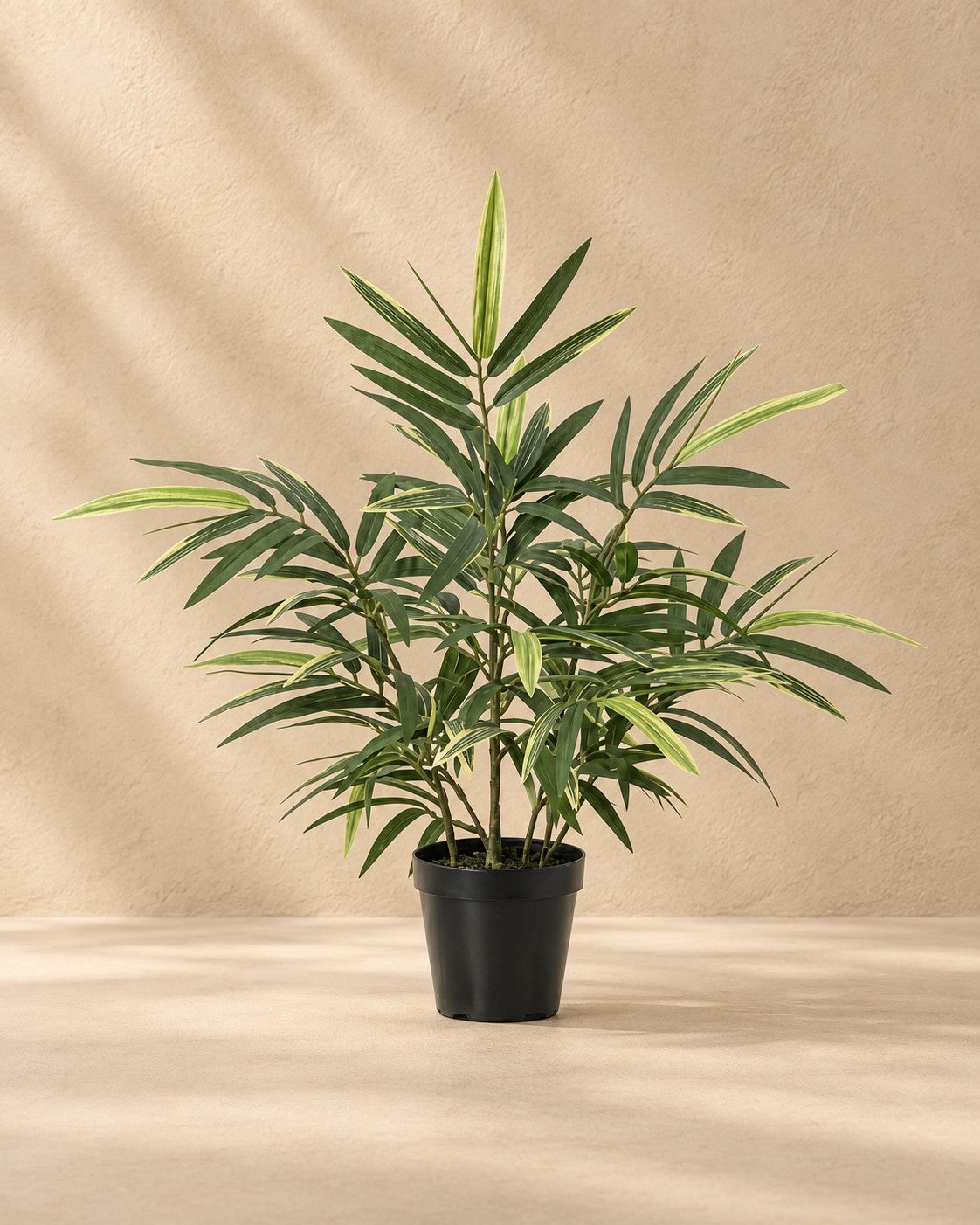 Kunstplant Bamboe van 57 cm hoog in pot van 12 cm