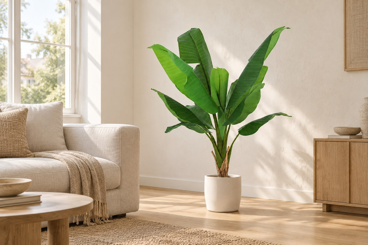 Artificial plant Banana plant Musa, 120 cm, in a white ceramic planter in a bright living room
